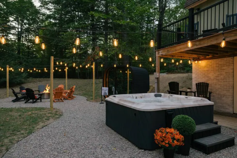 7-person hot tub cedar sauna fire pit deck at Peak and Pine Retreat Bartlett NH
