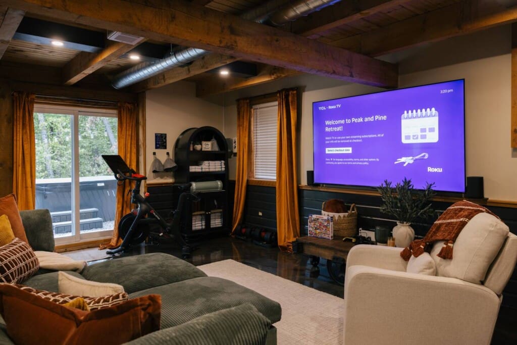 Bedroom with smart TV and mountain views at Peak and Pine Retreat