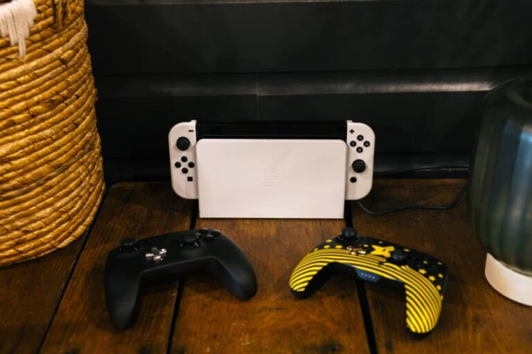 Nintendo Switch gaming console with controllers for guests at Peak and Pine Retreat