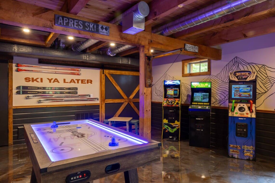 Game room entertainment area with arcade games at Peak and Pine Retreat cabin