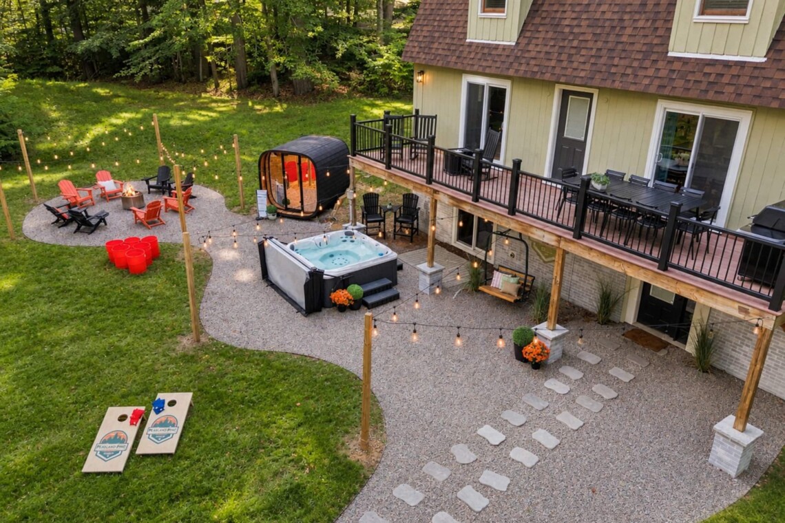 Overhead view of deck, hot tub, sauna and fire pit at Peak & Pine Retreat