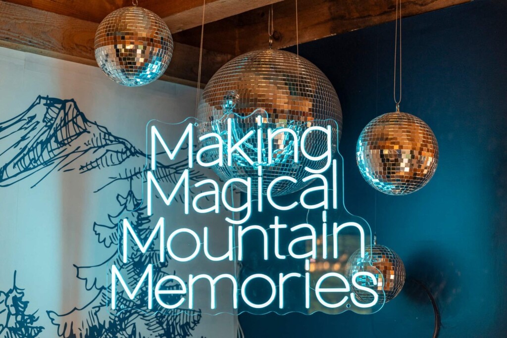 Making Magical Mountain Memories neon sign with hanging disco balls