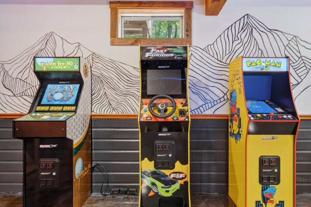 Three full-size arcade machines including Pac-Man at Peak & Pine Retreat