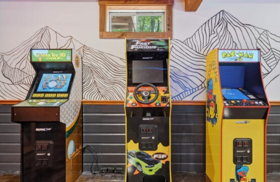 Three full-size arcade machines including Pac-Man at Peak & Pine Retreat