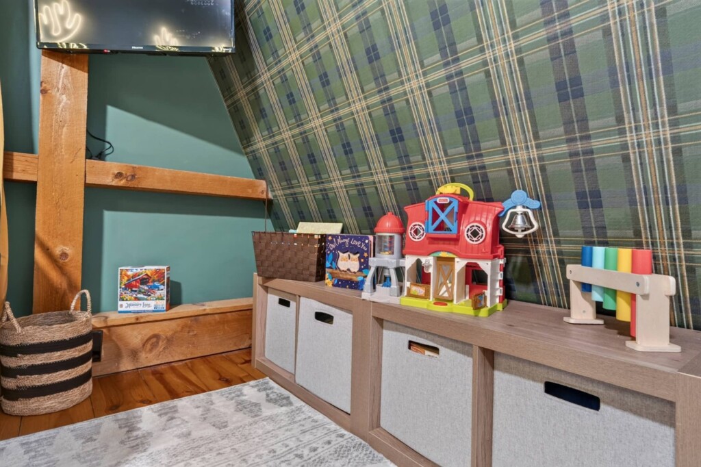 Kids toy storage bench with farm toys at Peak & Pine Retreat