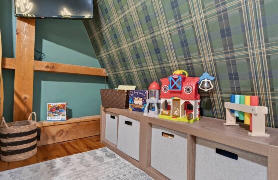 Kids toy storage bench with farm toys at Peak & Pine Retreat