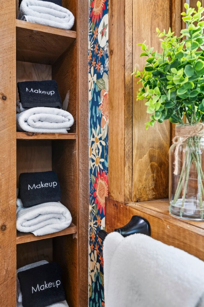 Open shelves with rolled towels and makeup remover cloths in the bathroom