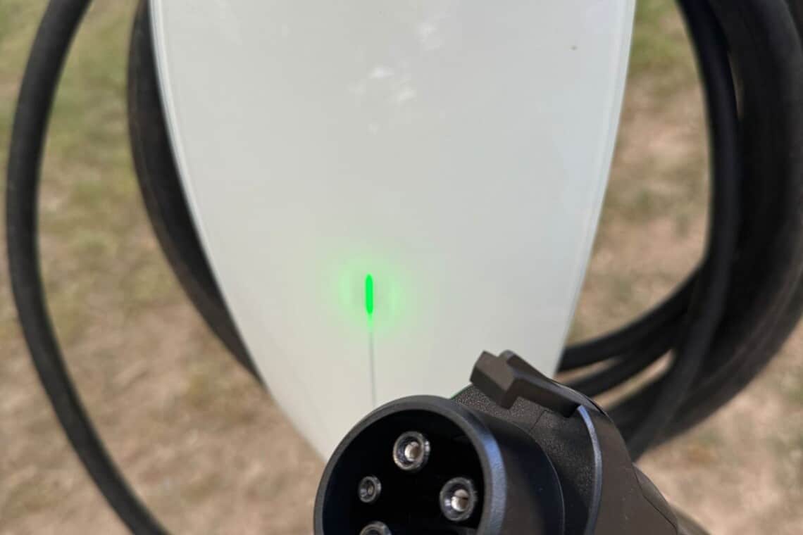 Close-up of the Tesla EV charging connector and cable