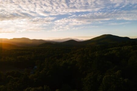 Sunset over the forested White Mountains near North Conway NH